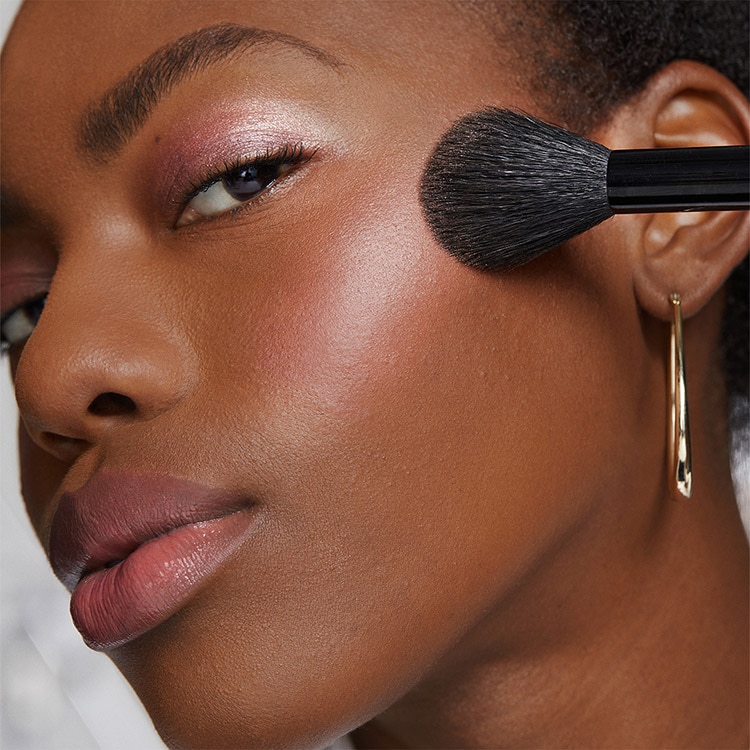 Close up of Bronzer with powder background